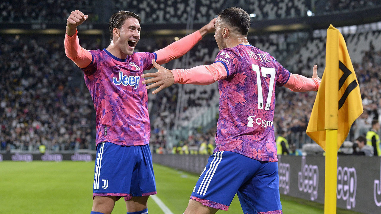 TURIN, ITALY - OCTOBER 02: Filip Kostic of Juventus celebrates after scoring his team's first goal with teammates Dusan Vlahovic during the Serie A match between Juventus and Bologna FC at Allianz Stadium on October 02, 2022 in Turin, Italy.