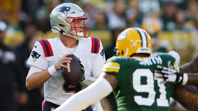 GREEN BAY, WISCONSIN - OCTOBER 02: Bailey Zappe #4 of the New England Patriots attempts a pass during the second quarter against the Green Bay Packers at Lambeau Field on October 02, 2022 in Green Bay, Wisconsin.