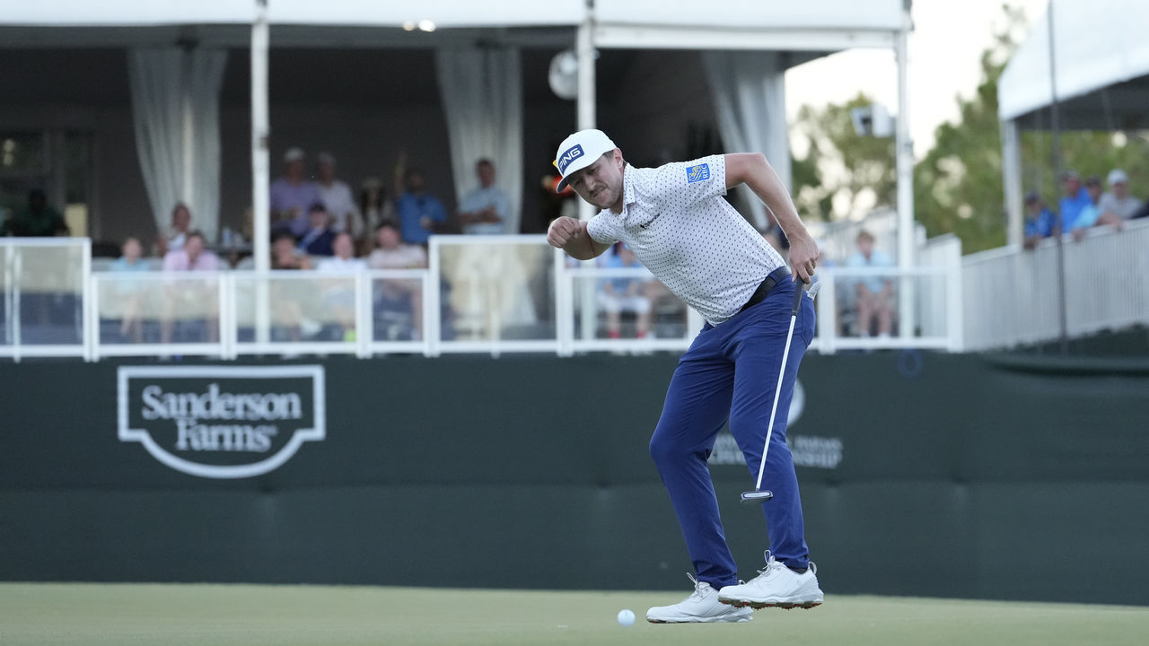 JACKSON, MISSISSIPPI - OCTOBER 02: Mackenzie Hughes of Canada reacts after putting in to win on the second playoff hole against Sepp Straka of Austria on the 18th green during the final round of the Sanderson Farms Championship at The Country Club of Jackson on October 02, 2022 in Jackson, Mississippi.