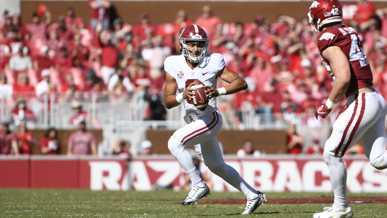 FAYETTEVILLE, AR - OCTOBER 01: Alabama Crimson Tide quarterback Bryce Young (9) scrambles during the college football game between the Alabama Crimson Tide and Arkansas Razorbacks on October 1, 2022, at Donald W. Reynolds Razorback Stadium in Fayetteville, Arkansas.