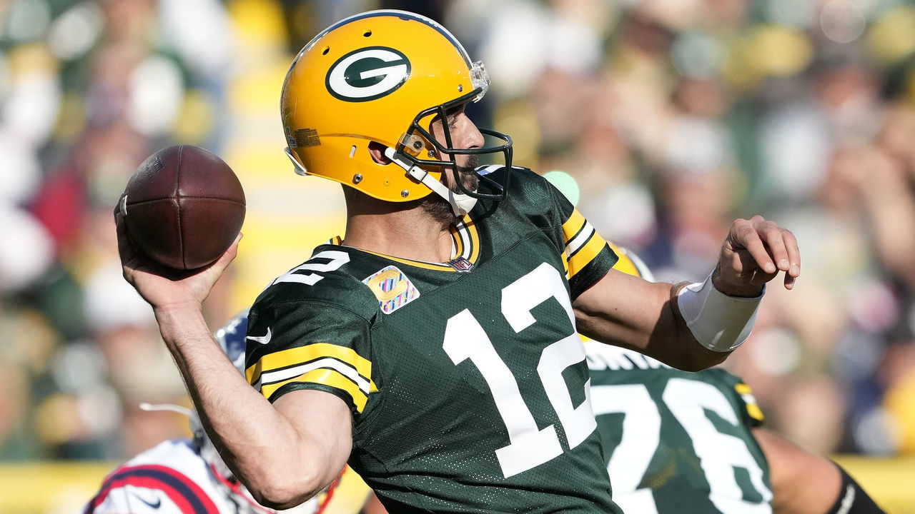 GREEN BAY, WISCONSIN - OCTOBER 02: Aaron Rodgers #12 of the Green Bay Packers attempts a pass during the second quarter against the New England Patriots at Lambeau Field on October 02, 2022 in Green Bay, Wisconsin.
