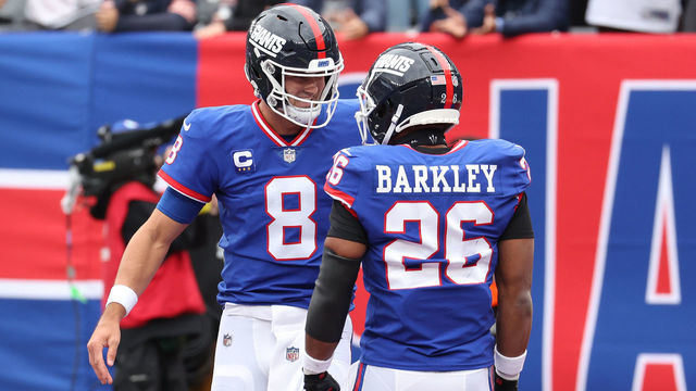 EAST RUTHERFORD, NEW JERSEY - OCTOBER 02: Daniel Jones #8 of the New York Giants celebrates his touchdown with Saquon Barkley #26 of the New York Giants in the first half of the game against the Chicago Bears at MetLife Stadium on October 02, 2022 in East Rutherford, New Jersey.