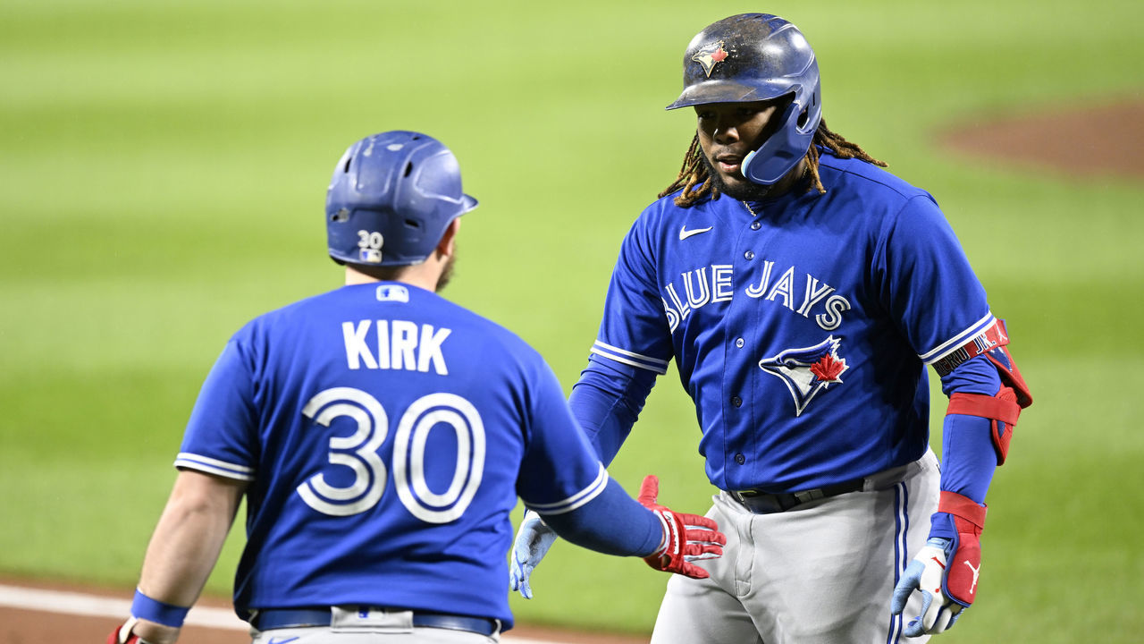 BALTIMORE, MARYLAND - OCTOBER 03: Vladimir Guerrero Jr. #27 of the Toronto Blue Jays celebrates with Alejandro Kirk #30 after hitting a home run in the third inning against the Baltimore Orioles at Oriole Park at Camden Yards on October 03, 2022 in Baltimore, Maryland.