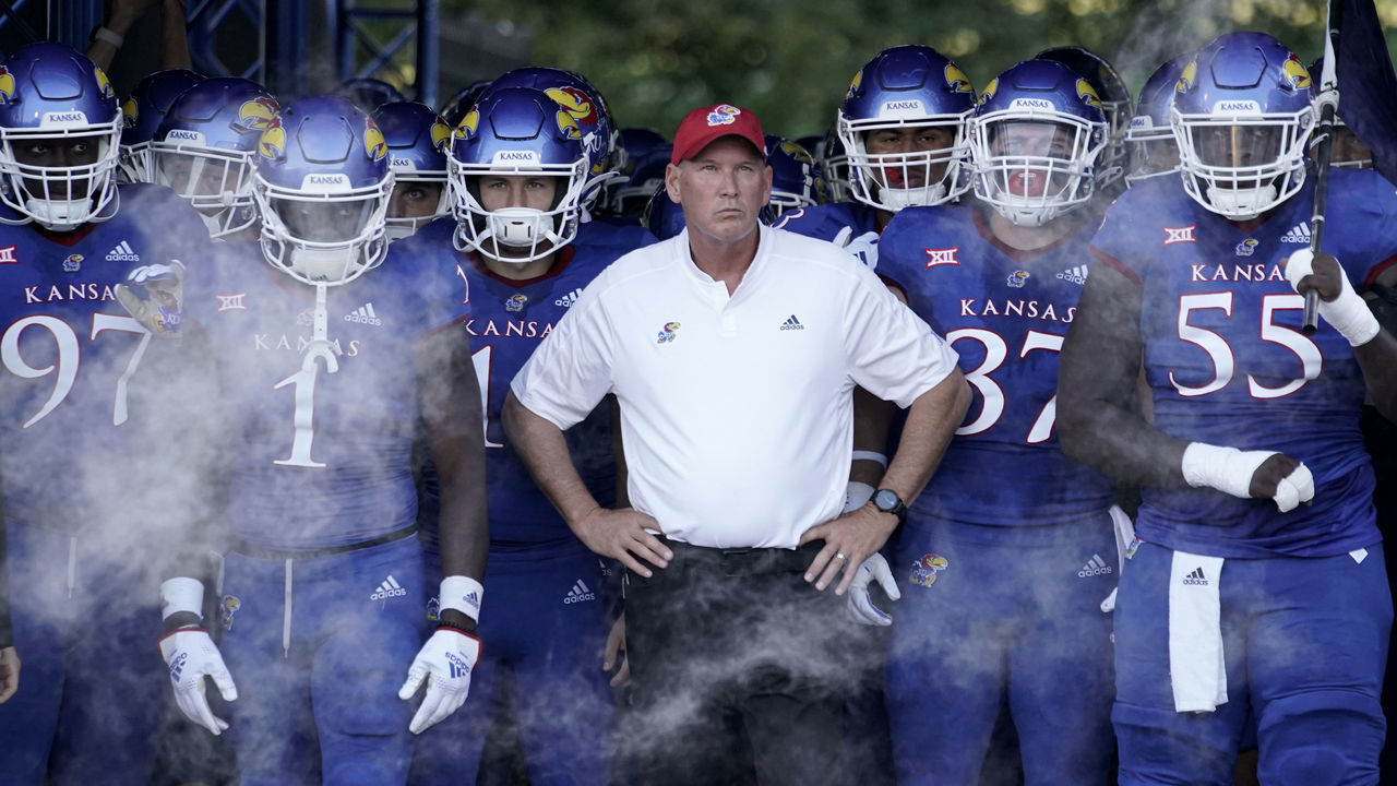 LAWRENCE, KS - SEPTEMBER 02: Head coach Lance Leipold of the Kansas Jayhawks stands with his players as they prepare to take the field prior to a game against the Tennessee Tech Golden Eagles at David Booth Kansas Memorial Stadium on September 2, 2022 in Lawrence, Kansas.