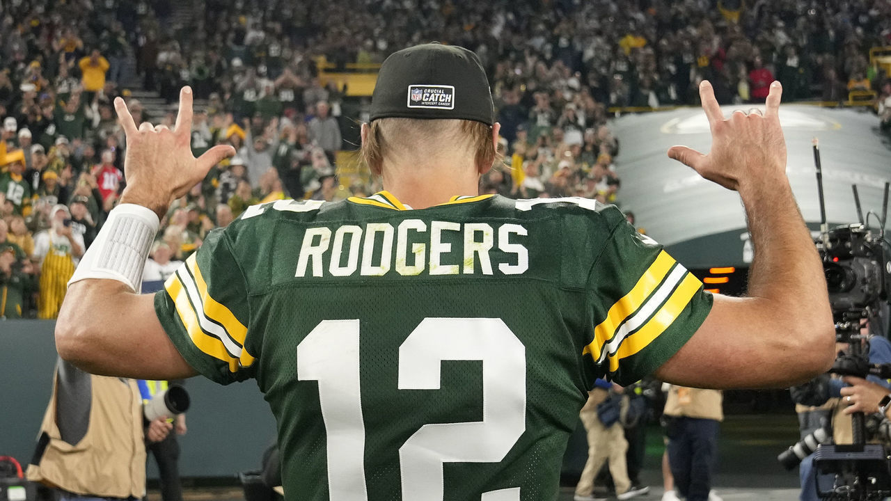 GREEN BAY, WISCONSIN - OCTOBER 02: Aaron Rodgers #12 of the Green Bay Packers celebrates after his team's 27-24 win in overtime against the New England Patriots at Lambeau Field on October 02, 2022 in Green Bay, Wisconsin.