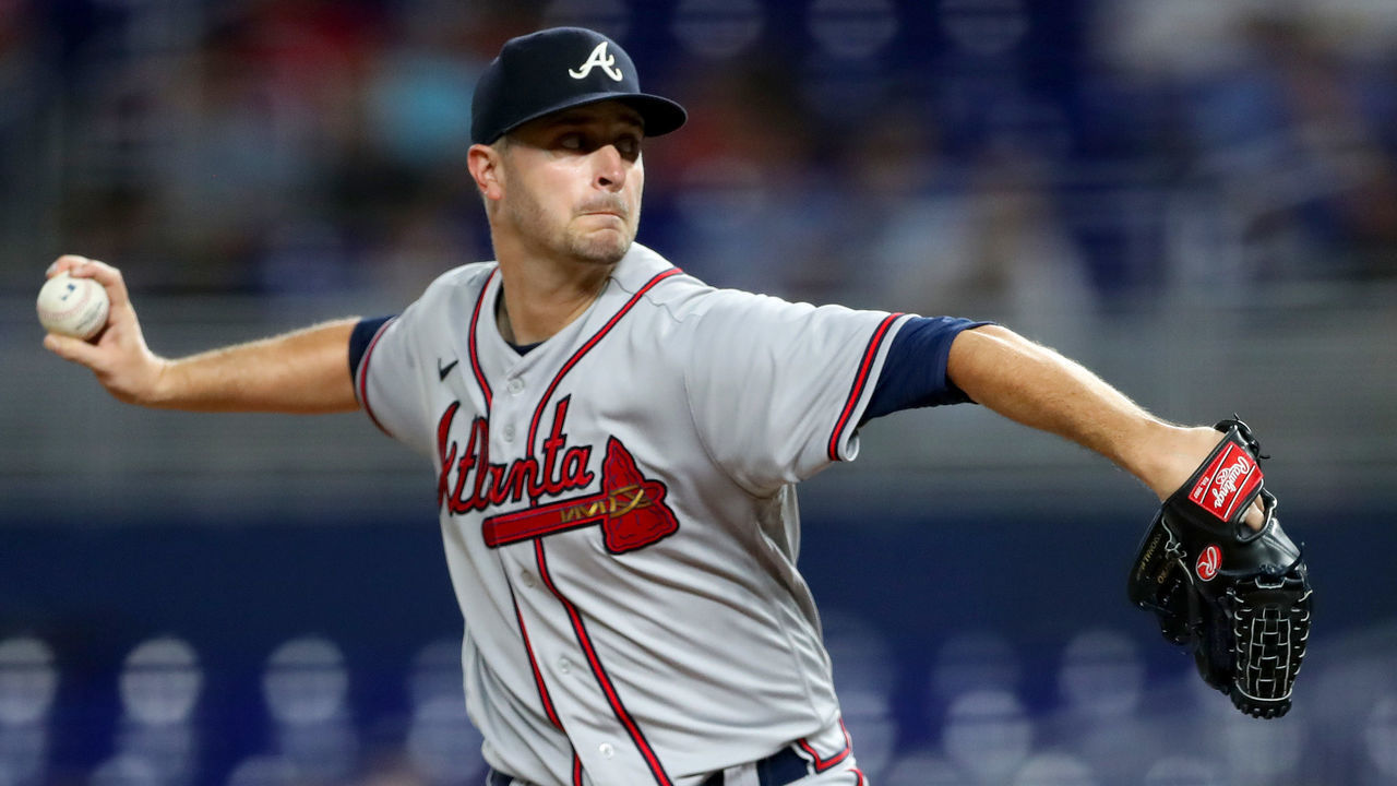 MIAMI, FLORIDA - OCTOBER 04: Jake Odorizzi #12 of the Atlanta Braves delivers a pitch against the Miami Marlins during the third inning of the game at loanDepot park on October 04, 2022 in Miami, Florida.