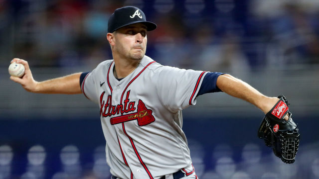 MIAMI, FLORIDA - OCTOBER 04: Jake Odorizzi #12 of the Atlanta Braves delivers a pitch against the Miami Marlins during the third inning of the game at loanDepot park on October 04, 2022 in Miami, Florida.
