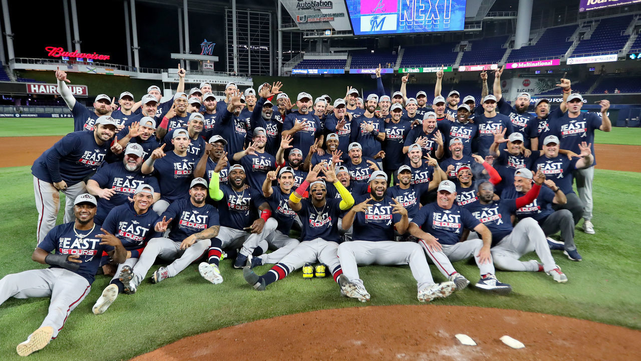 MIAMI, FLORIDA - OCTOBER 04: The Atlanta Braves pose for a group picture after clinching the division against the Miami Marlins at loanDepot park on October 04, 2022 in Miami, Florida.