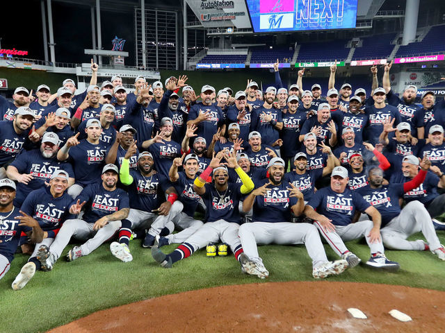 MIAMI, FLORIDA - OCTOBER 04: The Atlanta Braves pose for a group picture after clinching the division against the Miami Marlins at loanDepot park on October 04, 2022 in Miami, Florida.