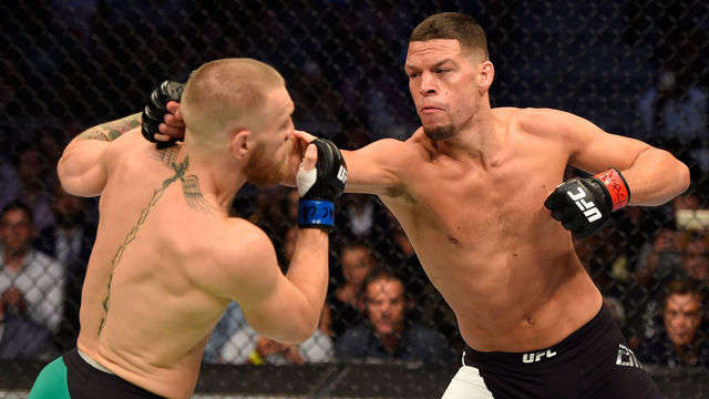 LAS VEGAS, NV - AUGUST 20: (R-L) Nate Diaz punches Conor McGregor of Ireland in their welterweight bout during the UFC 202 event at T-Mobile Arena on August 20, 2016 in Las Vegas, Nevada.