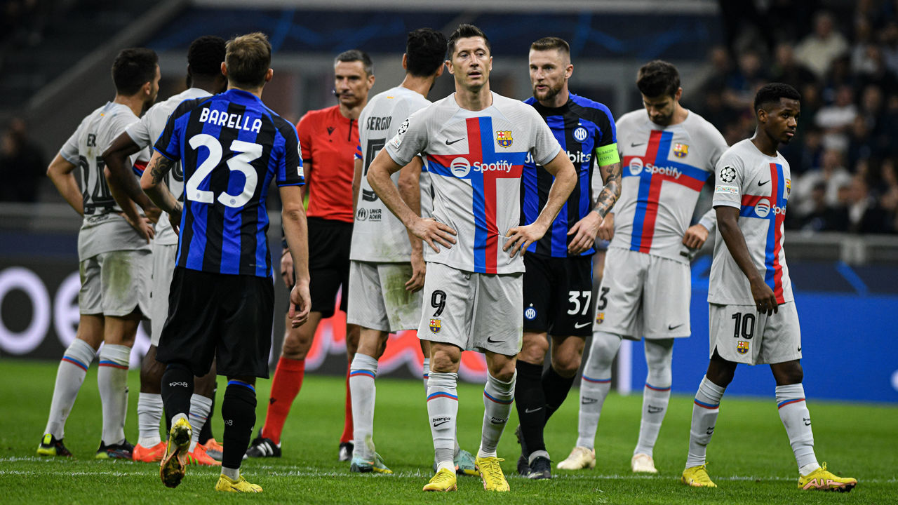 MILAN, ITALY - OCTOBER 4: Robert Lewandowski (9) of FC Barcelona and Milan Skriniar (37)of FC Internazionale are seen during the UEFA Champions League match between FC Internazionale and FC Barcelona at San Siro Stadium in Milan, Italy on October 4, 2022.