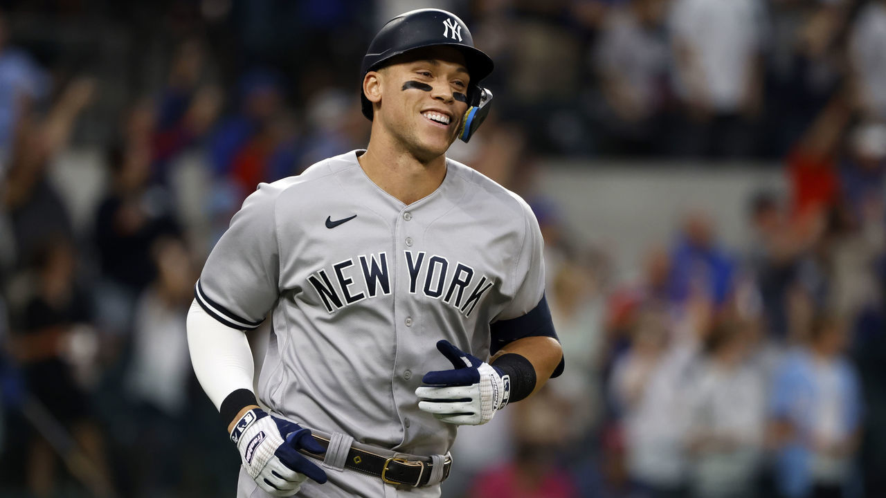 ARLINGTON, TX - OCTOBER 4: Aaron Judge #99 of the New York Yankees rounds the bases after hitting his 62nd home run of the season against the Texas Rangers during the first inning in game two of a double header at Globe Life Field on October 4, 2022 in Arlington, Texas. Judge has now set the American League record for home runs in a single season.