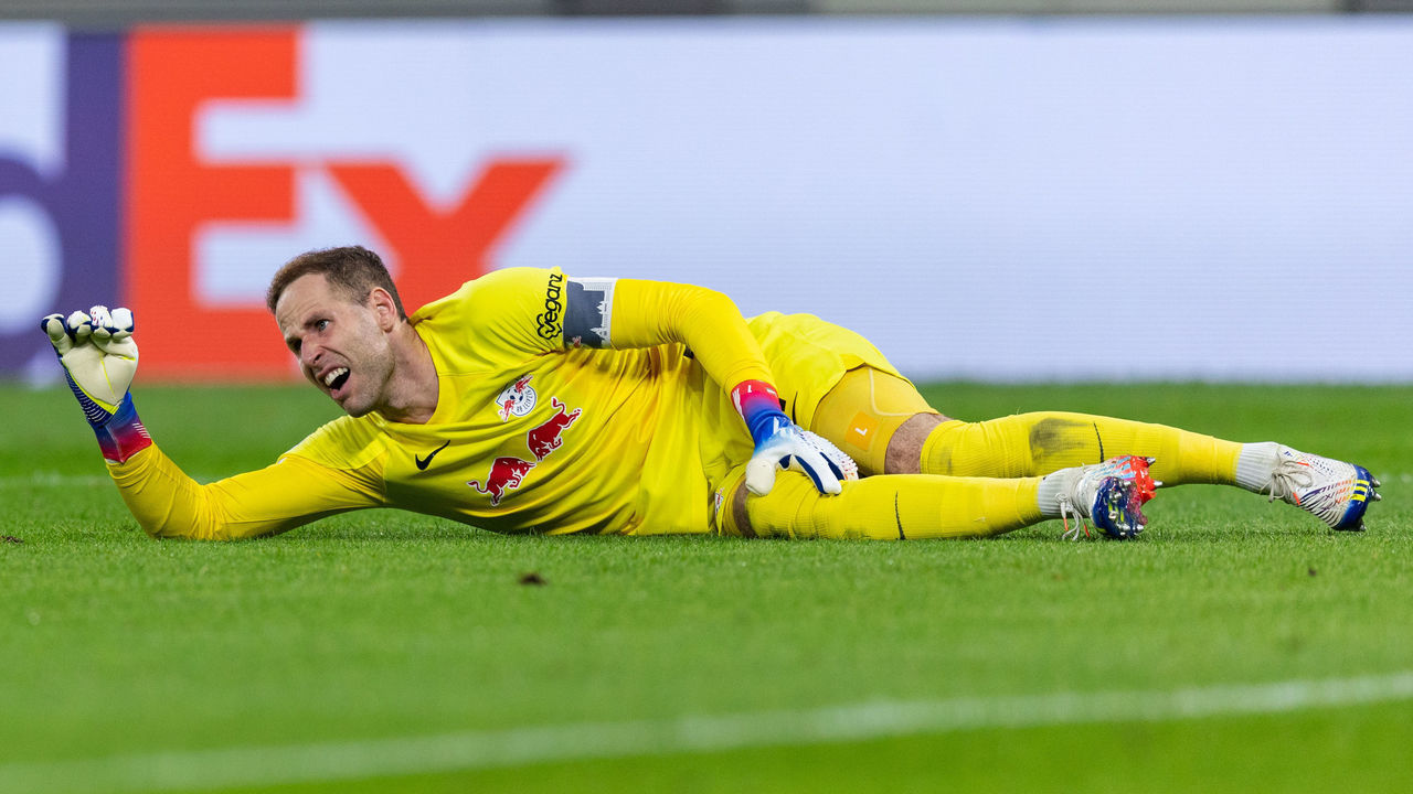 LEIPZIG, GERMANY - OCTOBER 05: Goalkeeper Peter Gulacsi of RB Leipzig takes an injury during the UEFA Champions League group F match between RB Leipzig and Celtic FC at Red Bull Arena on October 05, 2022 in Leipzig, Germany.