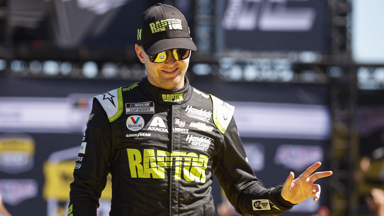 TALLADEGA, ALABAMA - OCTOBER 02: William Byron, driver of the #24 RaptorTough.com Chevrolet, waves to fans as he walks onstage during driver intros prior to the NASCAR Cup Series YellaWood 500 at Talladega Superspeedway on October 02, 2022 in Talladega, Alabama.