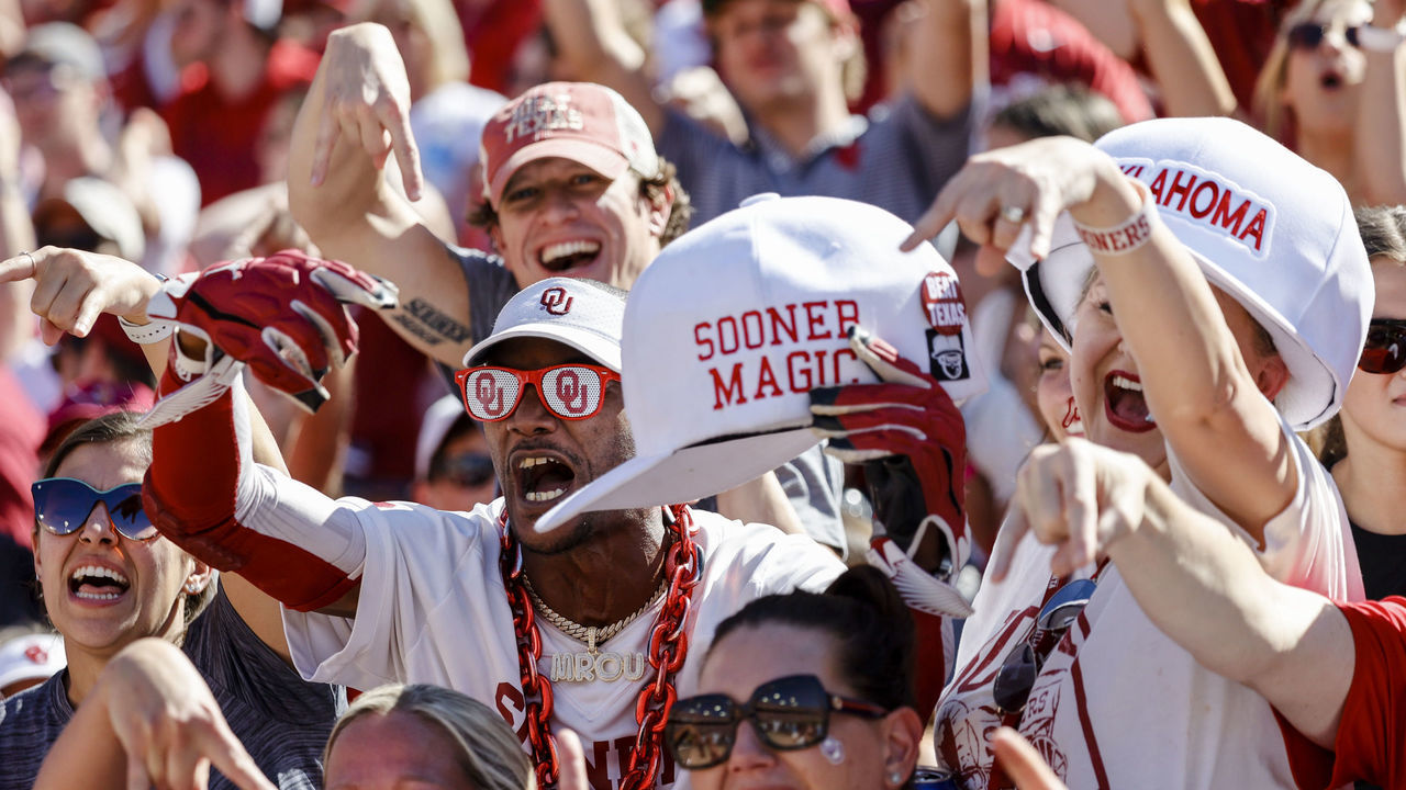DALLAS, TX - OCTOBER 09: Oklahoma Sooners fans cheer for their team during the Red River Showdown between the Texas Longhorns and the Oklahoma Sooners on October 09, 2021 at the Cotton Bowl in Dallas, Texas.