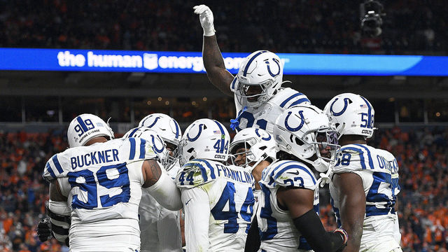 DENVER, COLORADO - OCTOBER 06: Stephon Gilmore #5 of the Indianapolis Colts intercepts a pass in the fourth quarter during a game against the Denver Broncos at Empower Field At Mile High on October 06, 2022 in Denver, Colorado.