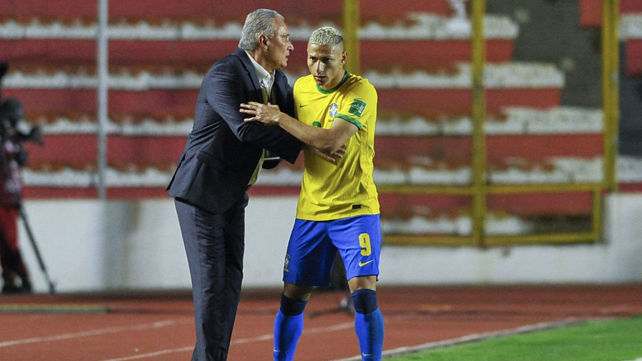 Brazil's Richarlison (R) celebrates with Brazil's coach Tite after scoring against Bolivia during their South American qualification football match for the FIFA World Cup Qatar 2022 at the Hernando Siles stadium in La Paz on March 29, 2022.