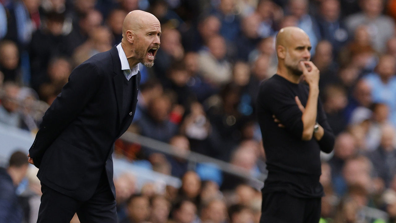 MANCHESTER, ENGLAND - OCTOBER 02: Manager Erik ten Hag of Manchester United and Manager Pep Guardiola of Manchester City watch from the touchling during the Premier League match between Manchester City and Manchester United at Etihad Stadium on October 02, 2022 in Manchester, England.