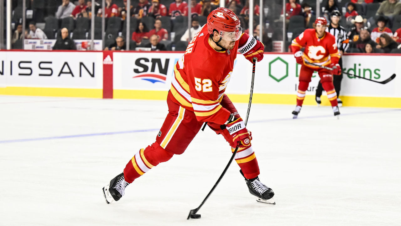 CALGARY, AB - SEPTEMBER 25: Calgary Flames Defenceman MacKenzie Weegar (52) takes a shot on the power play during the third period of an NHL pre-season game between the Calgary Flames and the Vancouver Canucks on September 25, 2022, at the Scotiabank Saddledome in Calgary, AB.