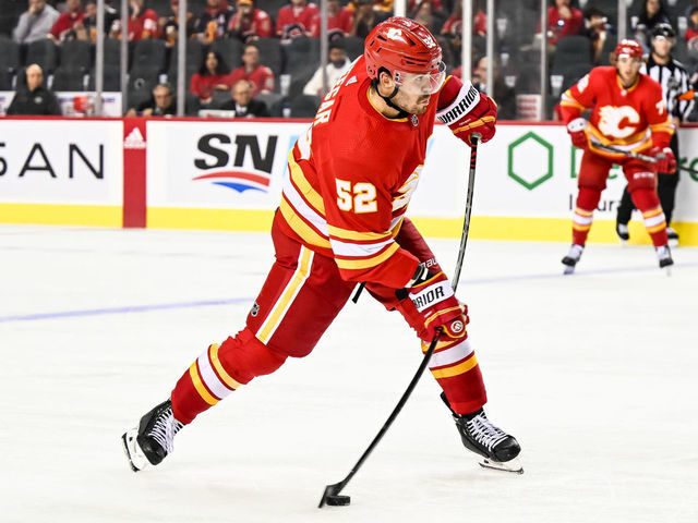 CALGARY, AB - SEPTEMBER 25: Calgary Flames Defenceman MacKenzie Weegar (52) takes a shot on the power play during the third period of an NHL pre-season game between the Calgary Flames and the Vancouver Canucks on September 25, 2022, at the Scotiabank Saddledome in Calgary, AB.