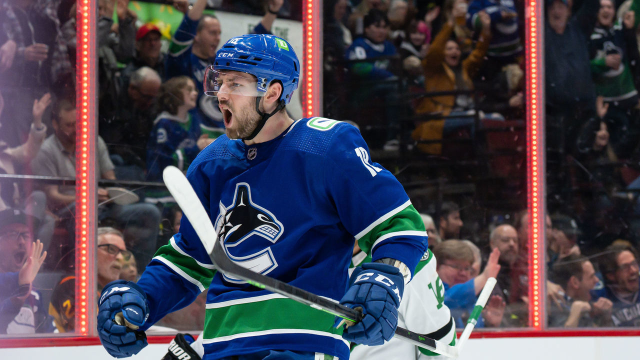 VANCOUVER, BC - APRIL 18: Vancouver Canucks center Jason Dickinson (18) celebrates after scoring a goal against the Dallas Stars during their NHL game at Rogers Arena on April 18, 2022 in Vancouver, British Columbia, Canada.