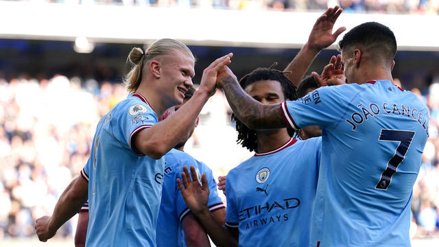 Manchester City's Erling Haaland (left) celebrates with team-mate Joao Cancelo after scoring their side's fourth goal of the game during the Premier League match at Etihad Stadium, Manchester. Picture date: Saturday October 8, 2022.