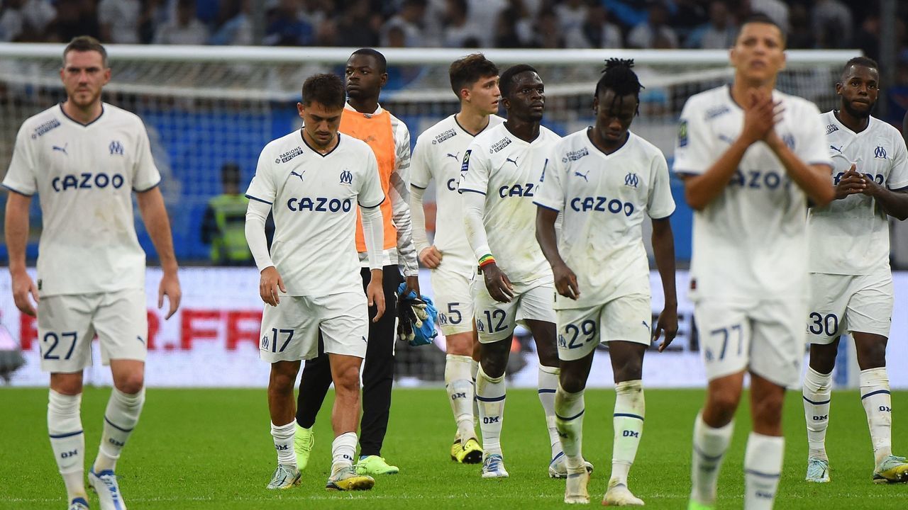 Marseille's players leave the pitch at the end of the French L1 football match between Olympique Marseille (OM) and AC Ajaccio at Stade Velodrome in Marseille, southern France on October 8, 2022.