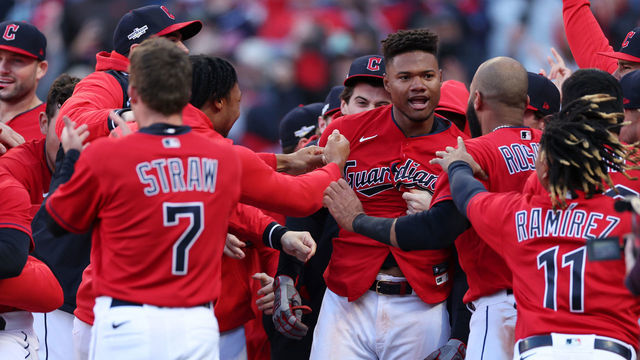 CLEVELAND, OHIO - OCTOBER 08: Oscar Gonzalez #39 of the Cleveland Guardians celebrates with teammates after hitting a walk-off home run to end the game in the fifteenth inning against the Tampa Bay Rays in game two of the Wild Card Series at Progressive Field on October 08, 2022 in Cleveland, Ohio.