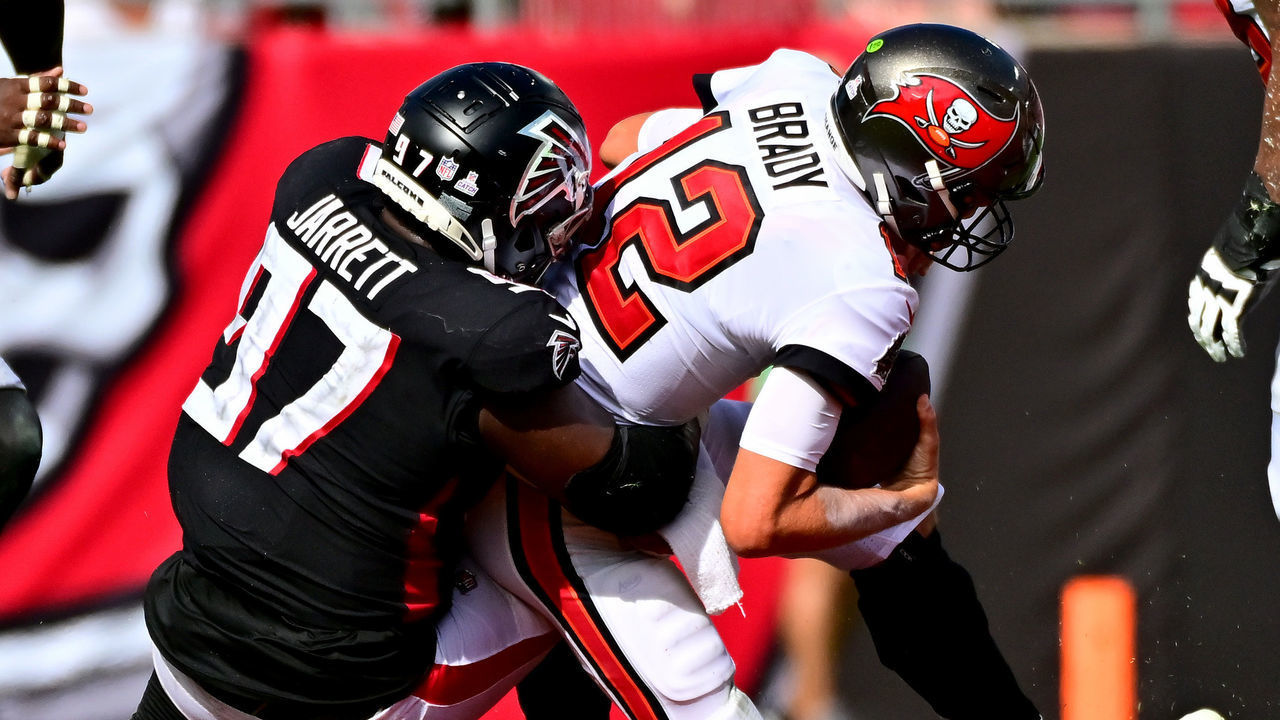 TAMPA, FLORIDA - OCTOBER 09: Grady Jarrett #97 of the Atlanta Falcons sacks Tom Brady #12 of the Tampa Bay Buccaneers during the fourth quarter of the game at Raymond James Stadium on October 09, 2022 in Tampa, Florida.