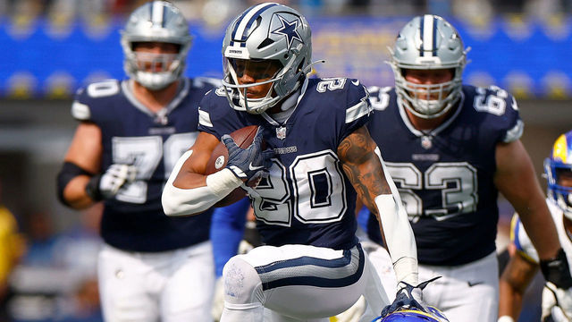 INGLEWOOD, CALIFORNIA - OCTOBER 09: Tony Pollard #20 of the Dallas Cowboys runs for a touchdown against Nick Scott #33 of the Los Angeles Rams during the second quarter at SoFi Stadium on October 09, 2022 in Inglewood, California.