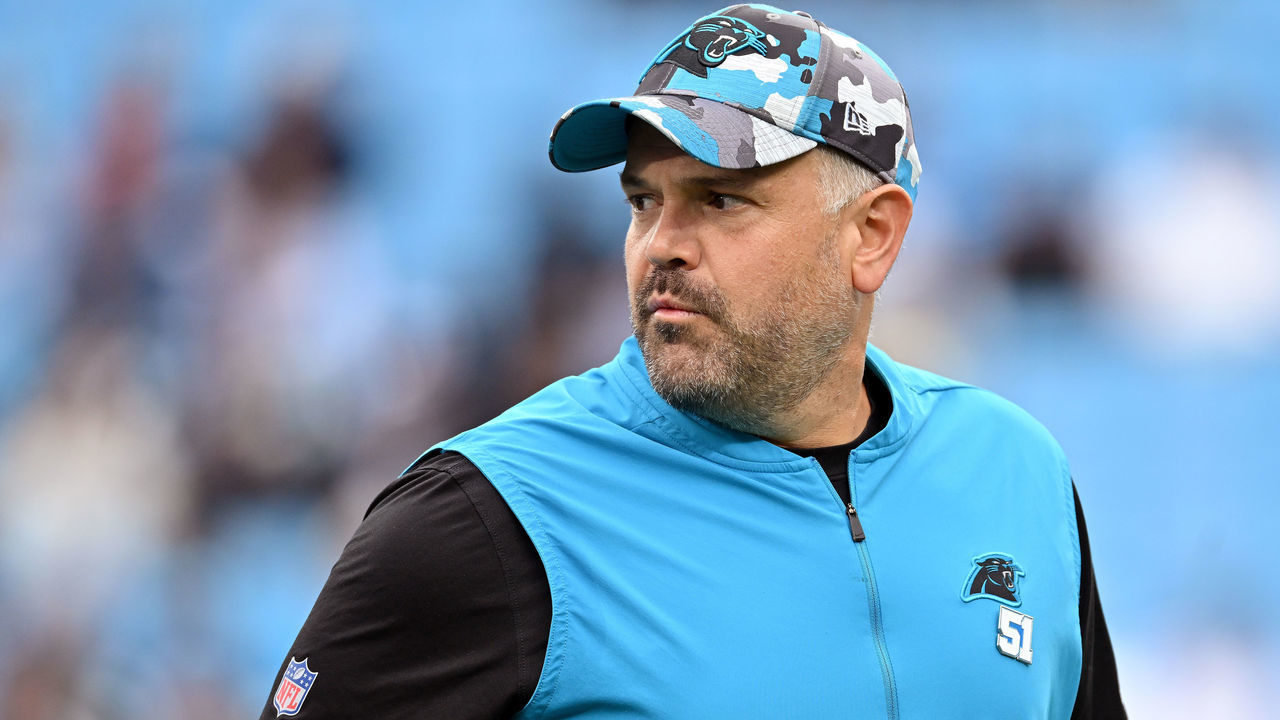 CHARLOTTE, NORTH CAROLINA - OCTOBER 02: Head coach Matt Rhule of the Carolina Panthers watches his team warm up during their game against the Arizona Cardinals at Bank of America Stadium on October 02, 2022 in Charlotte, North Carolina.
