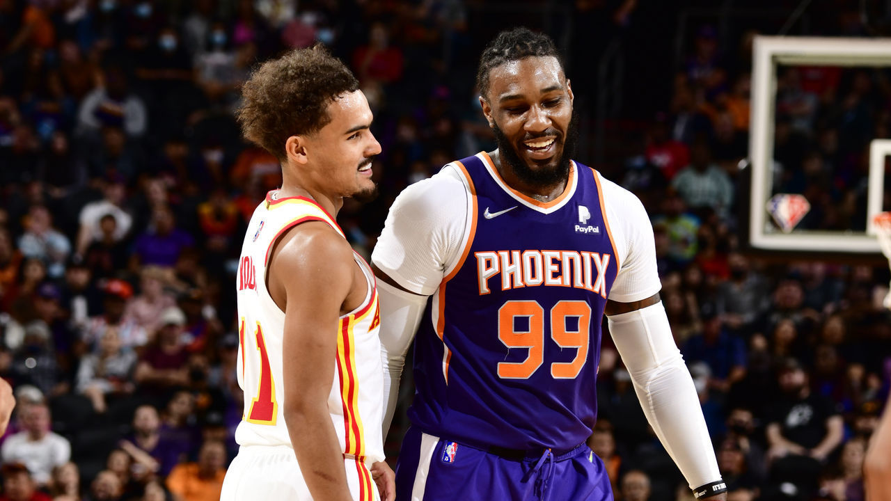 PHOENIX, AZ - NOVEMBER 6: Trae Young #11 of the Atlanta Hawks laughs with Jae Crowder #99 of the Phoenix Suns during the game on November 6, 2021 at Footprint Center in Phoenix, Arizona. Mandatory Copyright Notice: Copyright 2021 NBAE