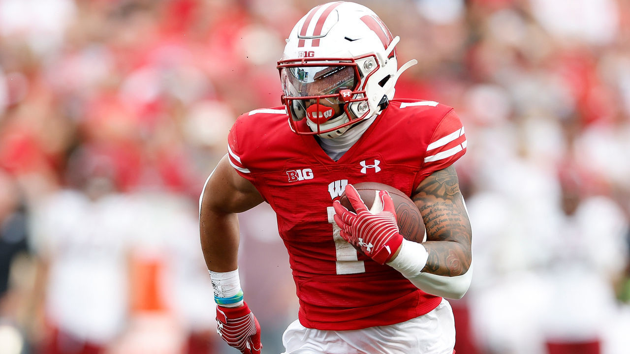 MADISON, WISCONSIN - SEPTEMBER 17: Chez Mellusi #1 of the Wisconsin Badgers rushes the ball during the game against the New Mexico Aggies at Camp Randall Stadium on September 17, 2022 in Madison, Wisconsin.