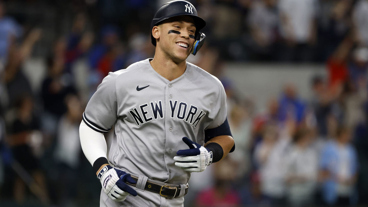 ARLINGTON, TX - OCTOBER 4: Aaron Judge #99 of the New York Yankees rounds the bases after hitting his 62nd home run of the season against the Texas Rangers during the first inning in game two of a double header at Globe Life Field on October 4, 2022 in Arlington, Texas. Judge has now set the American League record for home runs in a single season.