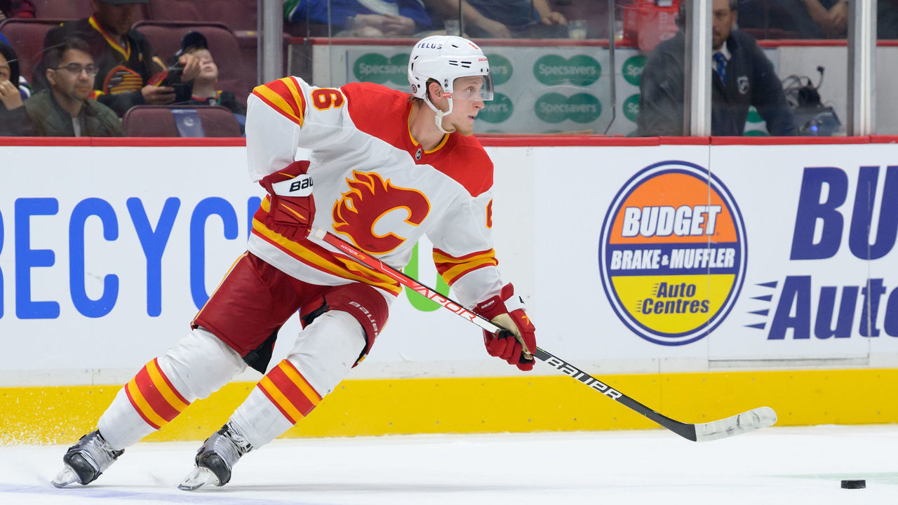 VANCOUVER, BC - SEPTEMBER 25: Calgary Flames defenseman Juuso Valimaki (6) skates with the puck during their preseason NHL game against the Vancouver Canucks at Rogers Arena on September 25, 2022 in Vancouver, British Columbia, Canada.