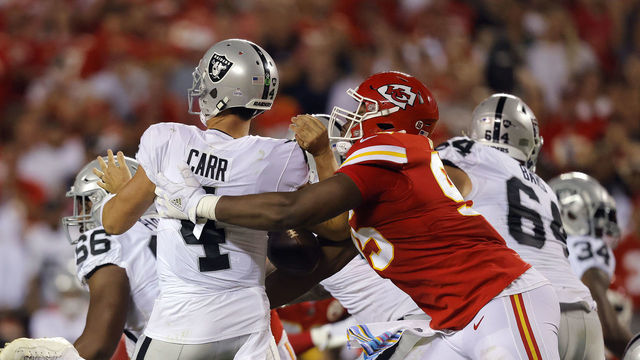 KANSAS CITY, MISSOURI - OCTOBER 10: Derek Carr #4 of the Las Vegas Raiders is sacked by Chris Jones #95 of the Kansas City Chiefs during the 2nd quarter of the game at Arrowhead Stadium on October 10, 2022 in Kansas City, Missouri. Jones was called for a penalty for roughing the passer.