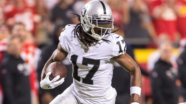 KANSAS CITY, MO - OCTOBER 10: Las Vegas Raiders wide receiver Davante Adams (17) runs the ball around Kansas City Chiefs cornerback Rashad Fenton (27) during the first half on October 10th, 2022 at GEHA field in Kansas City, Missouri.