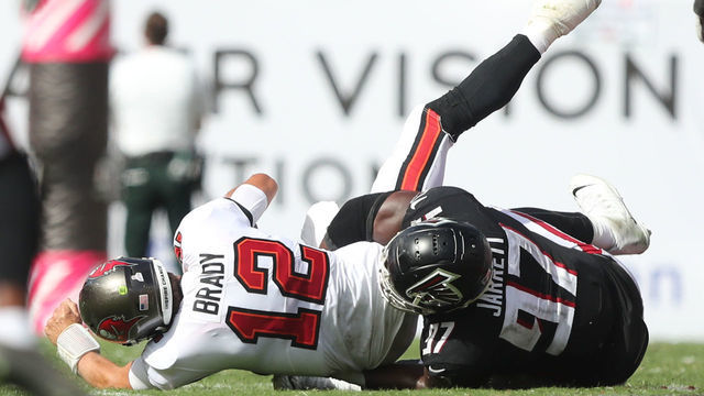 TAMPA, FL - OCTOBER 09: Atlanta Falcons Defensive Tackle Grady Jarrett (97) sacks Tampa Bay Buccaneers Quarterback Tom Brady (12) but receives a penalty on this play during the regular season game between the Atlanta Falcons and the Tampa Bay Buccaneers on October 09, 2022 at Raymond James Stadium in Tampa, Florida.