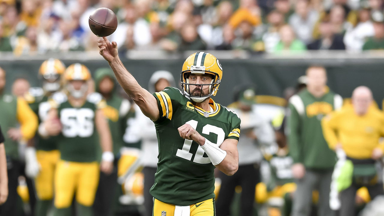 LONDON, ENGLAND - OCTOBER 09: Aaron Rodgers of Green Bay Packers throws the ball during the NFL match between New York Giants and Green Bay Packers at Tottenham Hotspur Stadium on October 9, 2022 in London, England.