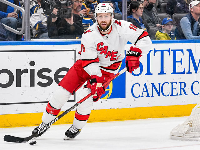 ST. LOUIS, MO - MARCH 26: Carolina Hurricanes center Derek Stepan (18) passes the puck out from behind his own net during a game between the Carolina Hurricanes and the St. Louis Blues on March 26, 2022, at the Enterprise Center in St. Louis MO
