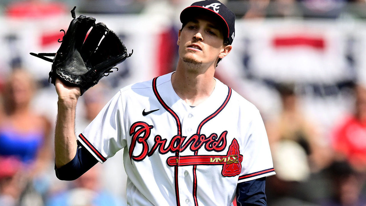 ATLANTA, GEORGIA - OCTOBER 11: Max Fried #54 of the Atlanta Braves reacts after a play at first base against the Philadelphia Phillies during the third inning in game one of the National League Division Series at Truist Park on October 11, 2022 in Atlanta, Georgia.