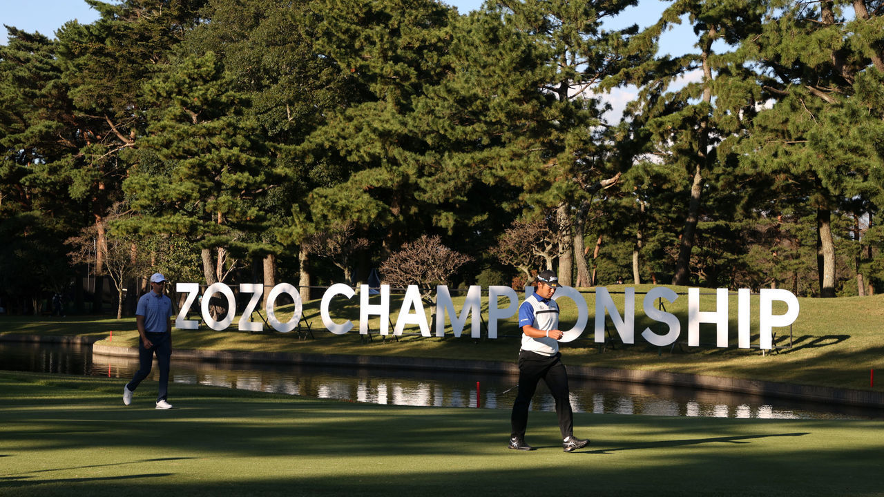 INZAI, JAPAN - OCTOBER 23: Hideki Matsuyama (R) of Japan and Cameron Tringale (L) of the United States leave on the 16th green during the third round of the ZOZO Championship at Accordia Golf Narashino Country Club on October 23, 2021 in Inzai, Chiba, Japan.