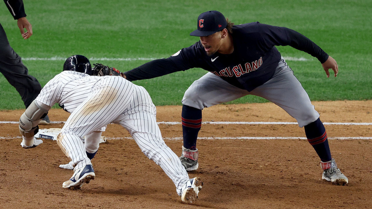 NEW YORK, NEW YORK - OCTOBER 11: Josh Donaldson #28 of the New York Yankees gets tagged out at first base by Josh Naylor #22 of the Cleveland Guardians during the fifth inning in game one of the American League Division Series at Yankee Stadium on October 11, 2022 in New York, New York.