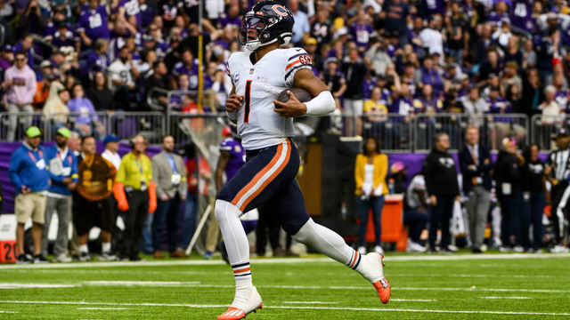 MINNEAPOLIS, MN - OCTOBER 09: Justin Fields #1 of the Chicago Bears scrambles with the ball in the fourth quarter of the game against the Minnesota Vikings at U.S. Bank Stadium on October 9, 2022 in Minneapolis, Minnesota. The play was ruled a touchdown, but was called back due to a penalty on the offense.