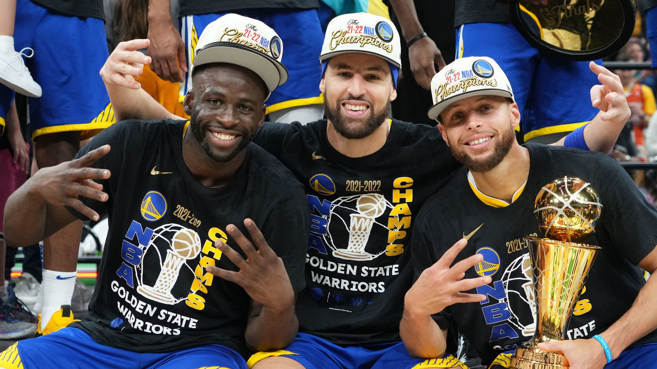 BOSTON, MA - JUNE 16: Draymond Green #23, Klay Thompson #11 and Stephen Curry #30 of the Golden State Warriors celebrate with the Bill Russell Finals MVP Trophy after winning during Game Six of the 2022 NBA Finals on June 16, 2022 at TD Garden in Boston, Massachusetts. NOTE TO USER: User expressly acknowledges and agrees that, by downloading and or using this photograph, user is consenting to the terms and conditions of Getty Images License Agreement. Mandatory Copyright Notice: Copyright 2022 NBAE