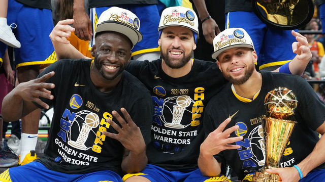 BOSTON, MA - JUNE 16: Draymond Green #23, Klay Thompson #11 and Stephen Curry #30 of the Golden State Warriors celebrate with the Bill Russell Finals MVP Trophy after winning during Game Six of the 2022 NBA Finals on June 16, 2022 at TD Garden in Boston, Massachusetts. NOTE TO USER: User expressly acknowledges and agrees that, by downloading and or using this photograph, user is consenting to the terms and conditions of Getty Images License Agreement. Mandatory Copyright Notice: Copyright 2022 NBAE