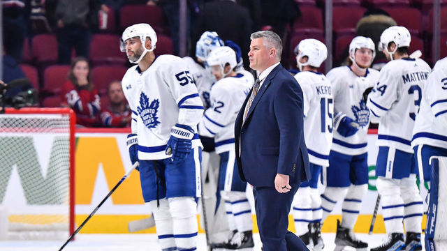 MONTREAL, CANADA - OCTOBER 03: Head coach of the Toronto Maple Leafs, Sheldon Keefe, walks across the ice after a victory against the Montreal Canadiens in a preseason game at Centre Bell on October 3, 2022 in Montreal, Quebec, Canada. The Toronto Maple Leafs defeated the Montreal Canadiens 5-1.