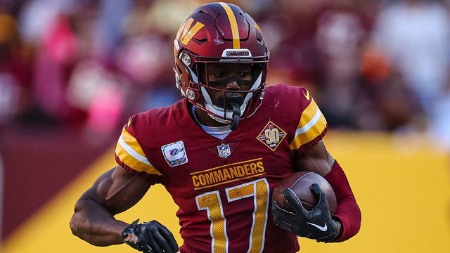 LANDOVER, MD - OCTOBER 09: Terry McLaurin #17 of the Washington Commanders carries the ball against the Tennessee Titans during the second half of the game at FedExField on October 9, 2022 in Landover, Maryland.