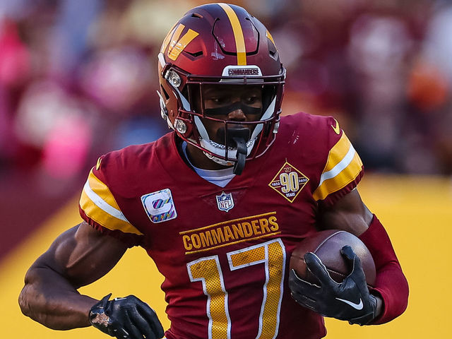 LANDOVER, MD - OCTOBER 09: Terry McLaurin #17 of the Washington Commanders carries the ball against the Tennessee Titans during the second half of the game at FedExField on October 9, 2022 in Landover, Maryland.