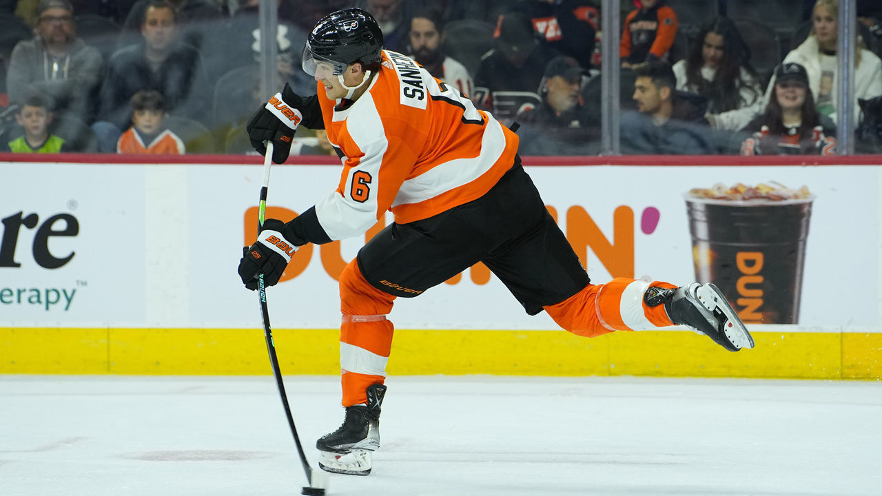 PHILADELPHIA, PA - OCTOBER 04: Philadelphia Flyers Defenseman Travis Sanheim (6) passes the puck during the second period of the National Hockey League preseason game between the New York Islanders and the Philadelphia Flyers on October 4, 2022 at the Wells Fargo Center in Philadelphia, PA.
